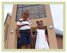 little boy and girls in front of St. Martin de Porres Catholic Church